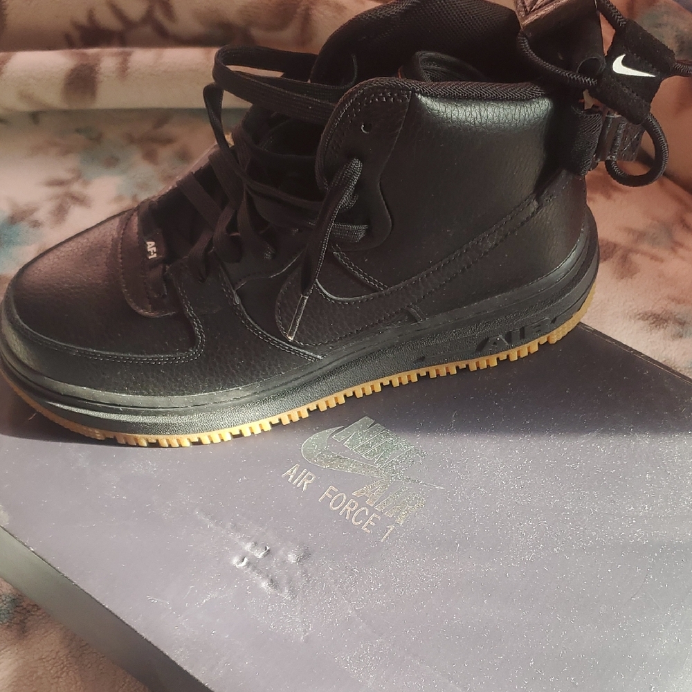 Nike Black High-Top Sneakers with Gold Accents